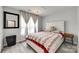 A bedroom with lots of natural light with a plush mattress and accent bedside tables at 7442 Crestside Ln, Charlotte, NC 28227