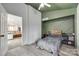 Another view of the secondary bedroom showing an open doorway and ample living space at 7442 Crestside Ln, Charlotte, NC 28227