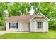 Charming single-Gathering home featuring a well-manicured lawn, a bay window, and inviting curb appeal at 7442 Crestside Ln, Charlotte, NC 28227