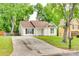 Charming single-Gathering home with a well-maintained lawn and a paved driveway at 7442 Crestside Ln, Charlotte, NC 28227