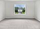 Spacious bedroom with a large window offering a clear view of the home's exterior at 752 Raindrops Rd, Gastonia, NC 28054