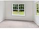 Bright bedroom featuring a large window offering a scenic view of the outdoor landscape at 752 Raindrops Rd, Gastonia, NC 28054