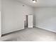 Minimalist bedroom design with soft carpet, a door to another room, and neutral tones at 752 Raindrops Rd, Gastonia, NC 28054