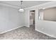 Cozy dining area showcasing modern lighting and a partial view of the adjacent kitchen at 752 Raindrops Rd, Gastonia, NC 28054