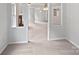 Open-concept living space with neutral tones, leading to other areas of the home at 752 Raindrops Rd, Gastonia, NC 28054