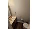 Cozy bathroom with a modern sink and toilet, featuring a neutral color scheme for a clean and comfortable feel at 7562 Petrea Ln, Charlotte, NC 28227