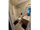 A full bathroom features a shower-tub combination and single sink vanity at 7562 Petrea Ln, Charlotte, NC 28227