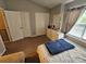 Bedroom features neutral color palette with natural light and and double closets at 7562 Petrea Ln, Charlotte, NC 28227