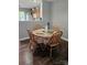 Charming dining area with a round table and wooden chairs, seamlessly connected to the kitchen and living spaces at 7562 Petrea Ln, Charlotte, NC 28227