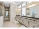 Bathroom featuring double sinks, granite countertops, tiled floors and plenty of storage at 7913 Waverly Walk Ave, Charlotte, NC 28277