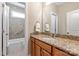 Bathroom with granite counters and a shower-tub combo offering a space for relaxation at 7913 Waverly Walk Ave, Charlotte, NC 28277