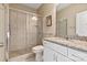 Bathroom with tiled shower, granite counters, and modern fixtures creating a stylish retreat at 7913 Waverly Walk Ave, Charlotte, NC 28277