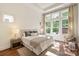Bright bedroom featuring large windows, hardwood floors and neutral decor for a relaxing atmosphere at 7913 Waverly Walk Ave, Charlotte, NC 28277