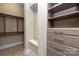 Walk-in closet with built-in shelves and drawers for organized storage solutions at 7913 Waverly Walk Ave, Charlotte, NC 28277