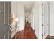 Bright foyer with hardwood floors, white walls, and an open view into the home at 7913 Waverly Walk Ave, Charlotte, NC 28277