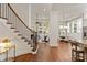 Grand foyer with hardwood floors, staircase, and view of the dining room and living room at 7913 Waverly Walk Ave, Charlotte, NC 28277