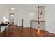 Hallway with hardwood floors, decorative lighting, and access to other rooms in the home at 7913 Waverly Walk Ave, Charlotte, NC 28277