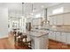 Elegant kitchen with granite countertops, an island with seating, and stainless steel appliances at 7913 Waverly Walk Ave, Charlotte, NC 28277