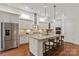 Elegant kitchen with granite countertops, an island with seating, and stainless steel appliances at 7913 Waverly Walk Ave, Charlotte, NC 28277