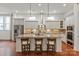 Elegant kitchen with granite countertops, an island with seating, and stainless steel appliances at 7913 Waverly Walk Ave, Charlotte, NC 28277