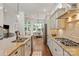 Bright, open kitchen with granite countertops, stainless steel appliances, and views to the dining area at 7913 Waverly Walk Ave, Charlotte, NC 28277