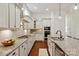 Elegant kitchen featuring a granite island, stainless appliances, and ample counter space at 7913 Waverly Walk Ave, Charlotte, NC 28277