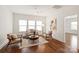 Bright living room with hardwood floors, neutral furniture, ceiling fan, and ample natural light from windows at 7913 Waverly Walk Ave, Charlotte, NC 28277