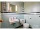 Charming retro bathroom featuring blue tiling and classic fixtures at 800 Old Little Rock Rd, Charlotte, NC 28214
