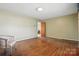 Cozy bedroom with hardwood floors and neutral paint, creating a serene and inviting atmosphere at 800 Old Little Rock Rd, Charlotte, NC 28214