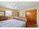 Bedroom featuring hardwood floors, a ceiling fan, and ample natural light at 800 Old Little Rock Rd, Charlotte, NC 28214