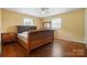 Bedroom featuring hardwood floors and a classic, neutral color scheme at 800 Old Little Rock Rd, Charlotte, NC 28214