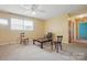 Cozy living room featuring carpet floors, a ceiling fan and natural light from the windows at 800 Old Little Rock Rd, Charlotte, NC 28214