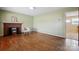 Spacious living room boasts hardwood floors, a brick fireplace, and fresh paint at 800 Old Little Rock Rd, Charlotte, NC 28214