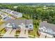 New construction townhomes with attached garages, attractive exteriors, and manicured lawns at 8215 Houser St, Cornelius, NC 28031