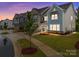 Charming new townhomes featuring craftsman-style architecture and well-maintained lawns at 8215 Houser St, Cornelius, NC 28031