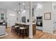Modern kitchen with an island, pendant lighting, stainless steel appliances, and white cabinetry at 8215 Houser St, Cornelius, NC 28031