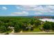 Expansive view of the lake house featuring lush greenery and a glimpse of Lake Hickory at 827 River Hills Ct, Taylorsville, NC 28681