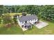Aerial view of the home showcasing a deck, patio, and driveway at 827 River Hills Ct, Taylorsville, NC 28681