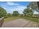 View from a deck overlooking a lush green yard and beautiful, mature trees at 827 River Hills Ct, Taylorsville, NC 28681