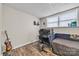 Finished basement featuring an office with a bed and a window with blinds at 827 River Hills Ct, Taylorsville, NC 28681