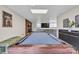 Basement recreation room featuring a pool table and modern decorations at 827 River Hills Ct, Taylorsville, NC 28681