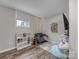 Finished basement featuring a cozy playroom with built-in shelves and decorative lighting at 827 River Hills Ct, Taylorsville, NC 28681