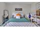 Bright bedroom offers a cozy sleeping area with carpet and wall décor, perfect for relaxation and personal expression at 827 River Hills Ct, Taylorsville, NC 28681