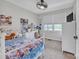 Bright bedroom boasts natural light, comfortable bedding, a desk, and closet, creating a cozy and practical space at 827 River Hills Ct, Taylorsville, NC 28681