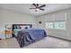 Cozy bedroom featuring a large bed with soft bedding and a ceiling fan for added comfort at 827 River Hills Ct, Taylorsville, NC 28681