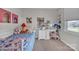 Bright, -friendly bedroom featuring unique decor, a desk area, and comfortable bedding at 827 River Hills Ct, Taylorsville, NC 28681
