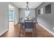 Stylish dining room with a large table, modern lighting, and access to the deck at 827 River Hills Ct, Taylorsville, NC 28681