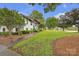 Charming home with a lush green lawn, mature trees, and a welcoming walkway at 827 River Hills Ct, Taylorsville, NC 28681