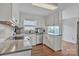 Modern kitchen featuring white cabinetry, stainless appliances, and hardwood floors at 827 River Hills Ct, Taylorsville, NC 28681