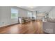 Comfortable living room featuring hardwood floors and a view of the staircase at 827 River Hills Ct, Taylorsville, NC 28681